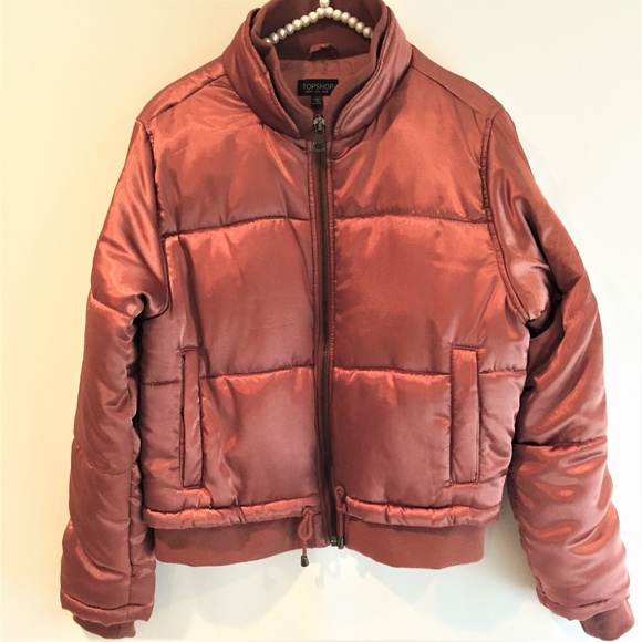 rust coloured puffer jacket